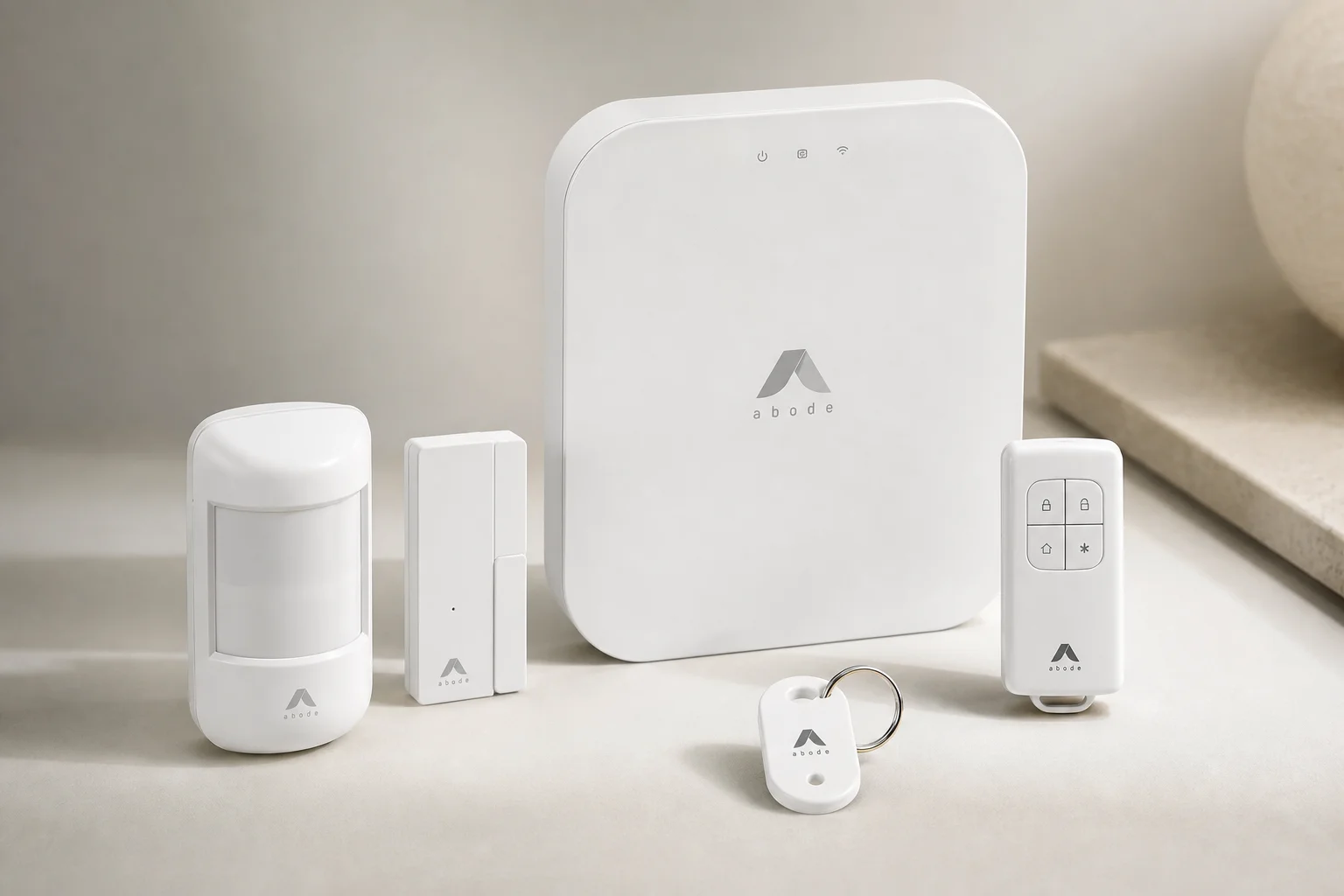 Smart home devices including hub, streaming device, thermostat, lock, and lights on a desk
