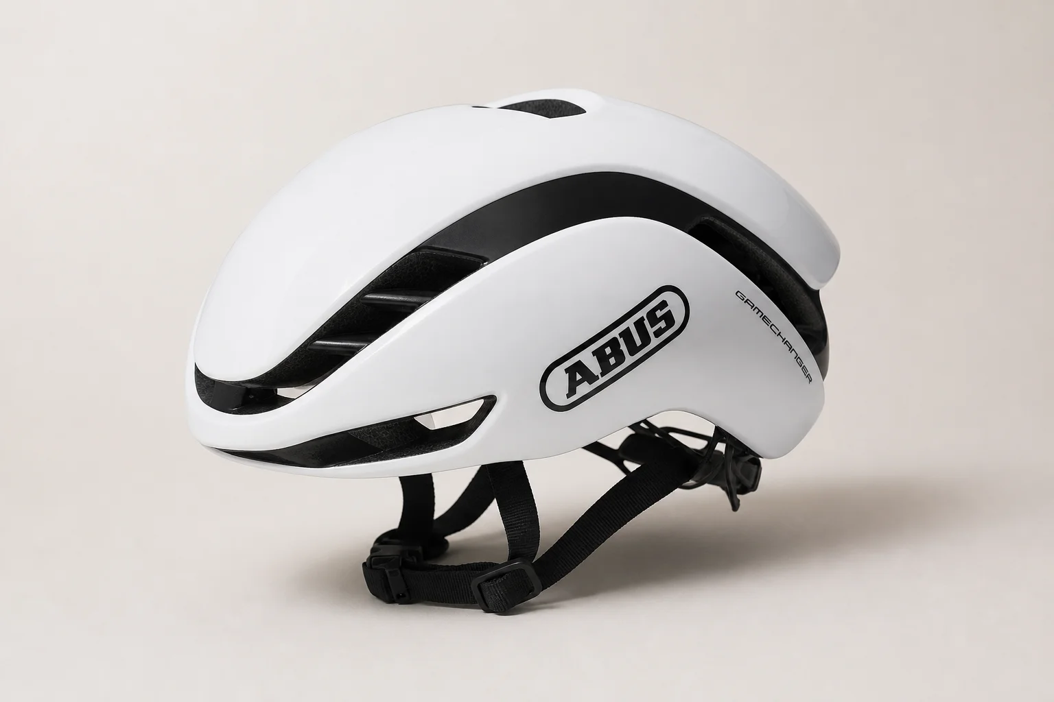 Six aerodynamic road cycling helmets arranged on concrete surface