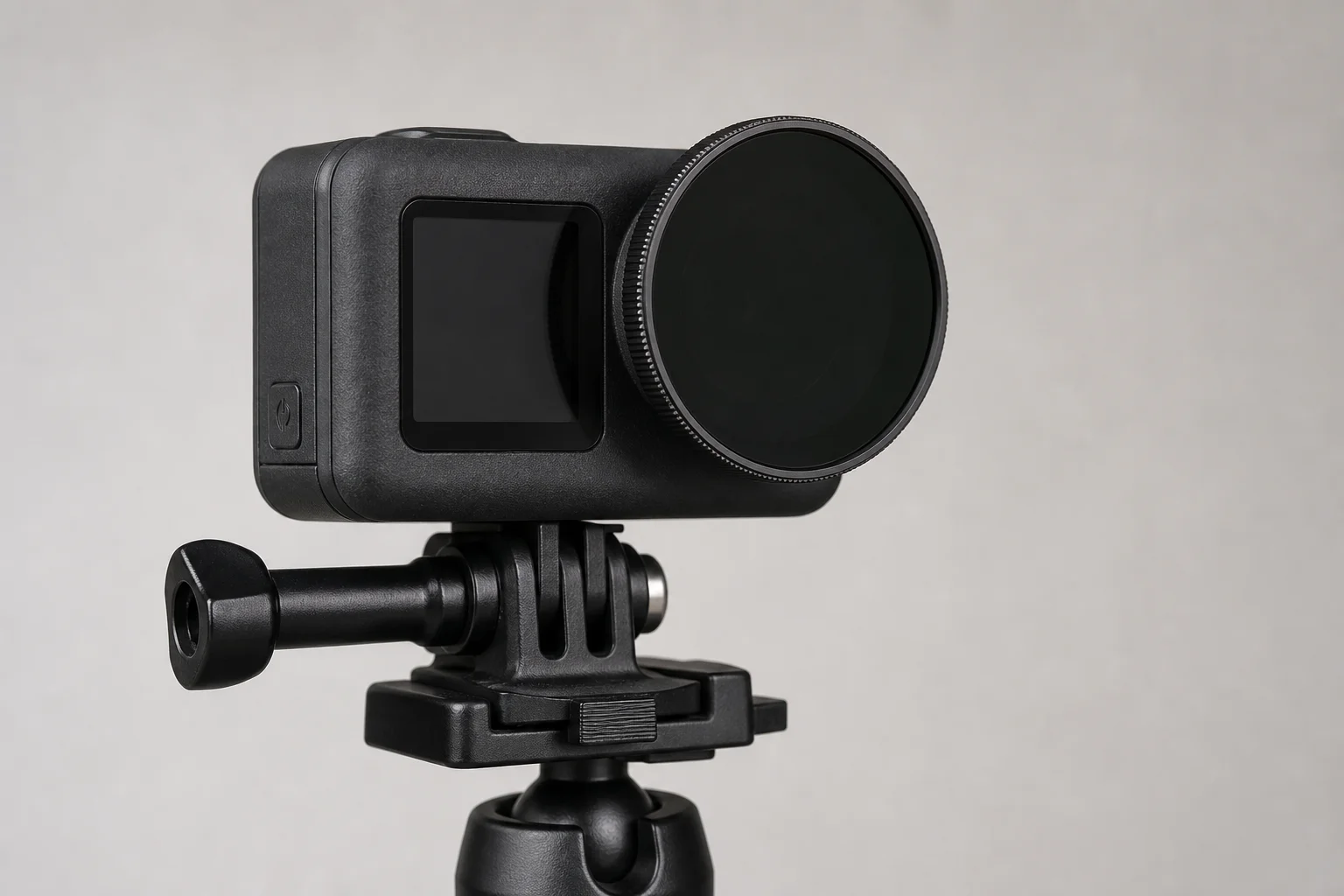 Action camera with ND filter attached to lens mounted on tripod