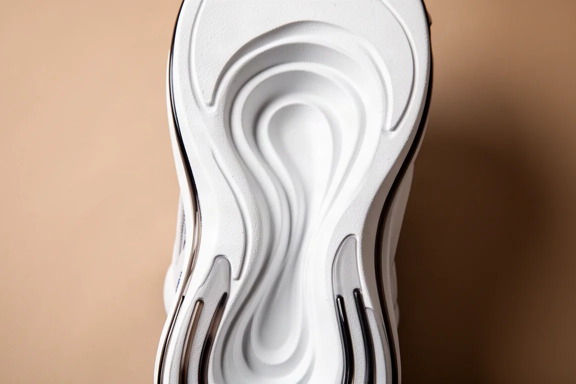 Worn thin rubber outsole edge of a racing shoe after a run