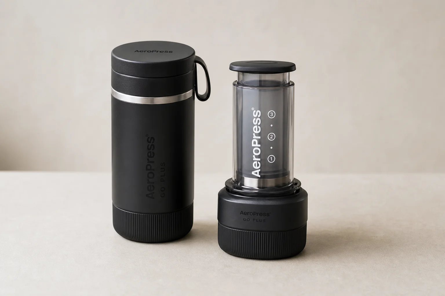 Five French press coffee makers arranged on concrete surface showing different sizes and styles