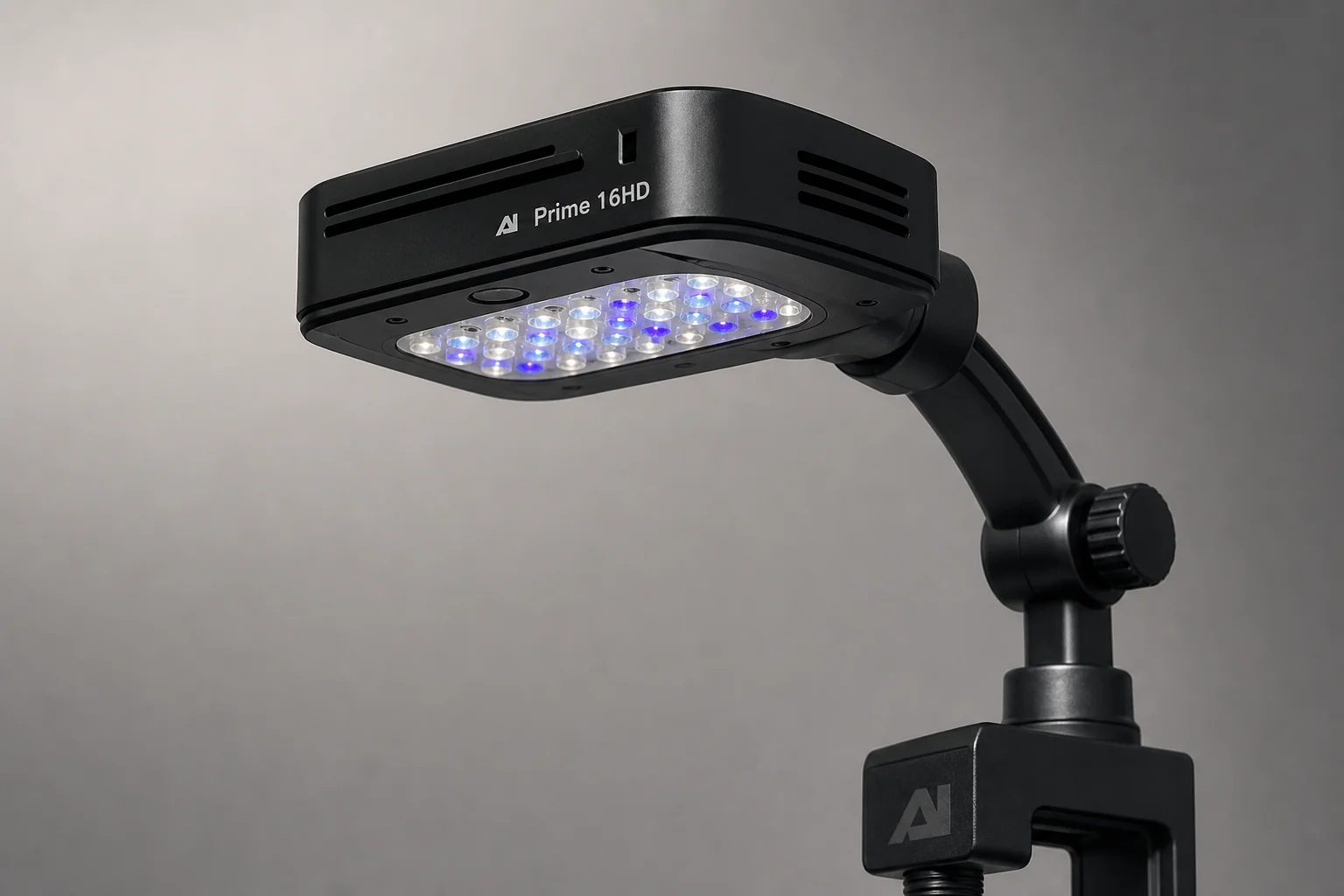 AI Prime 16HD and Red Sea ReefLED aquarium lights on dark surface