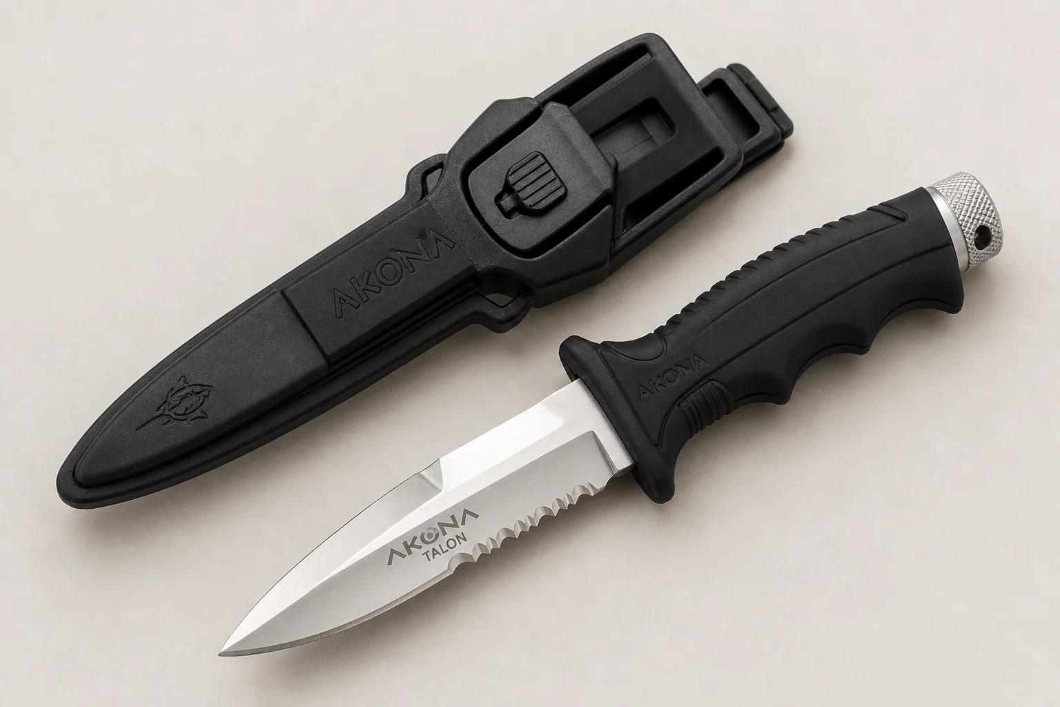 Collection of dive knives and cutting tools on concrete surface