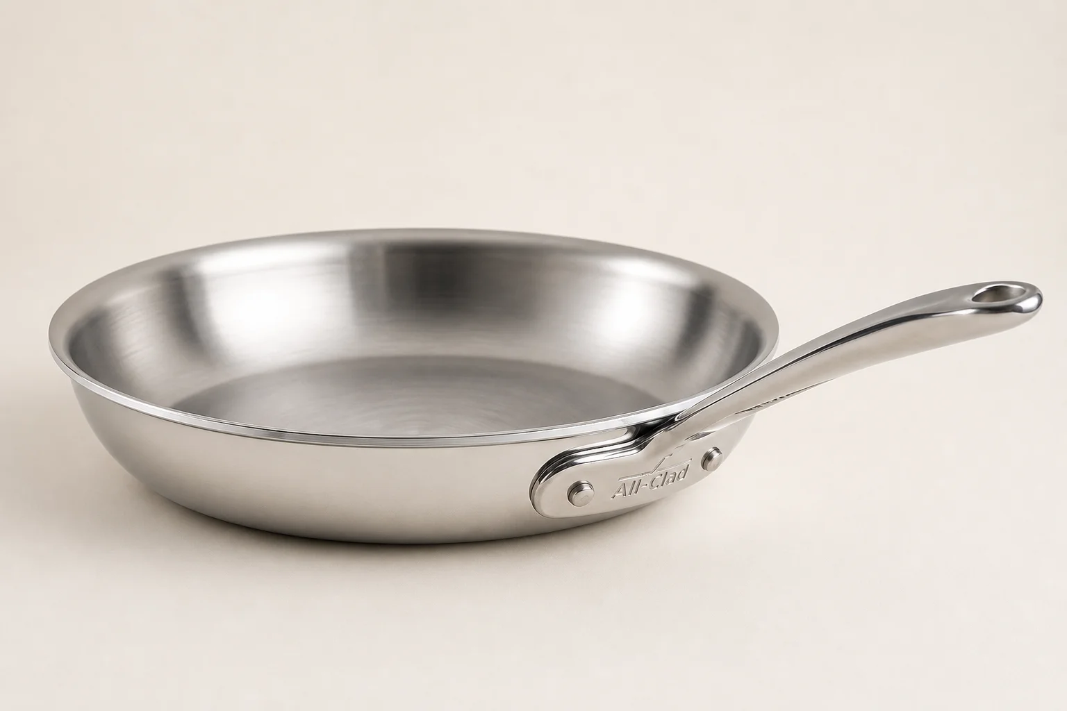 Modern induction cooktop with black glass surface and stainless steel cookware