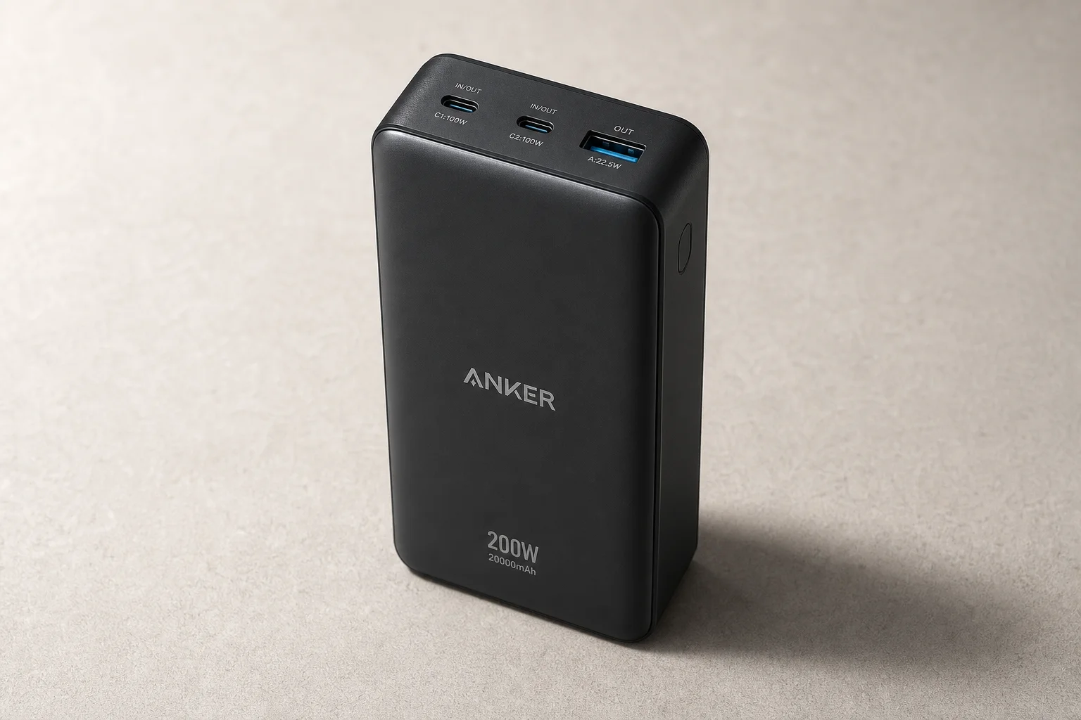 Six Anker power banks arranged on concrete surface showing size and design differences