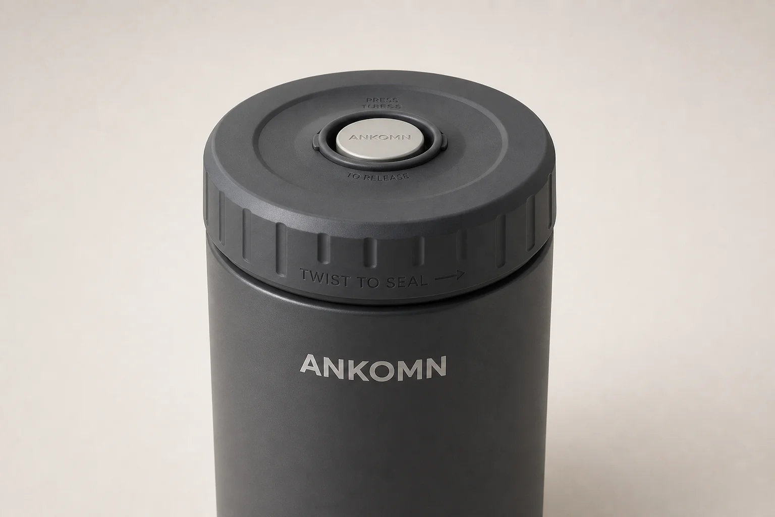 Eleven coffee storage containers arranged by category on concrete surface