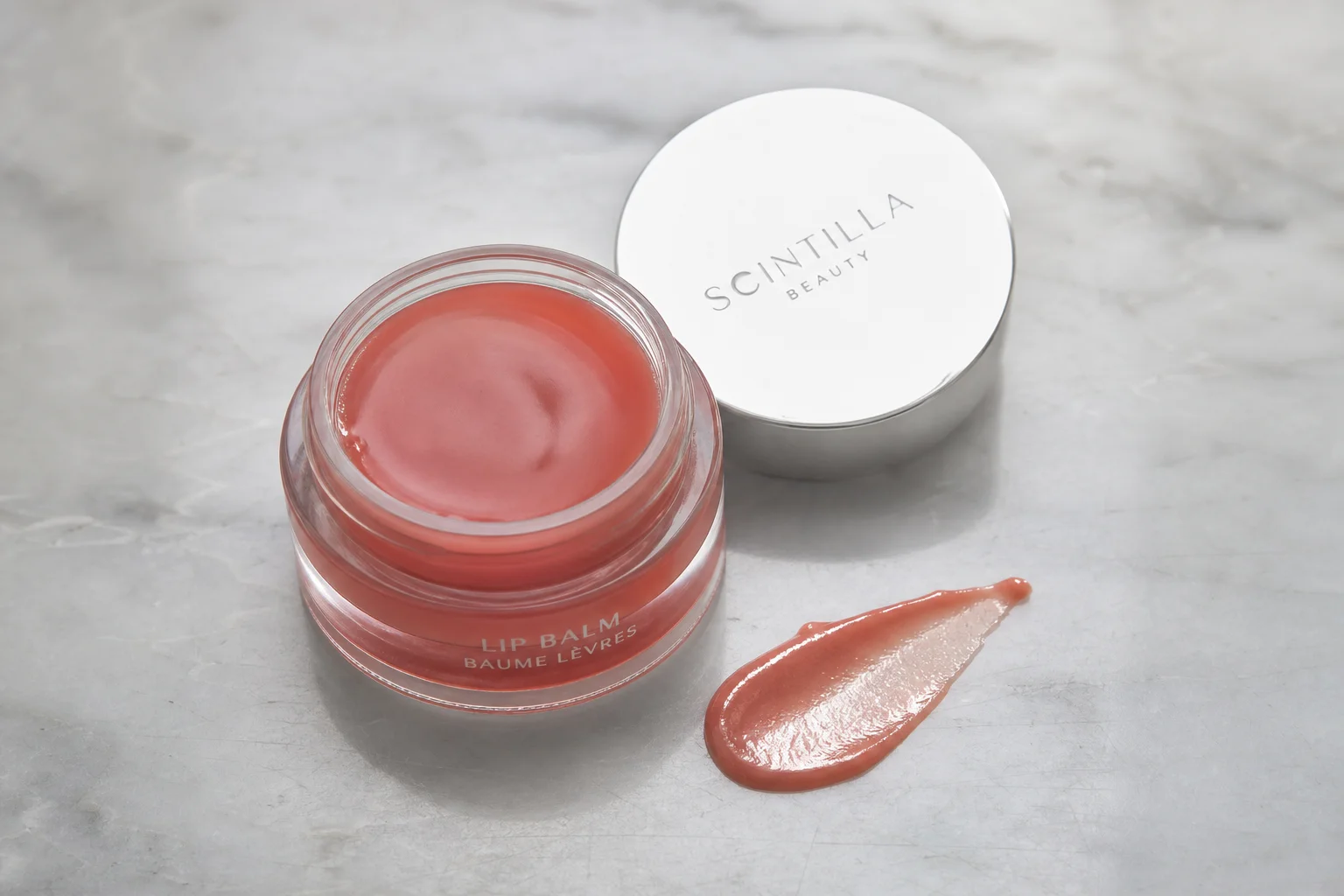 Collection of ten Korean beauty products arranged on marble surface