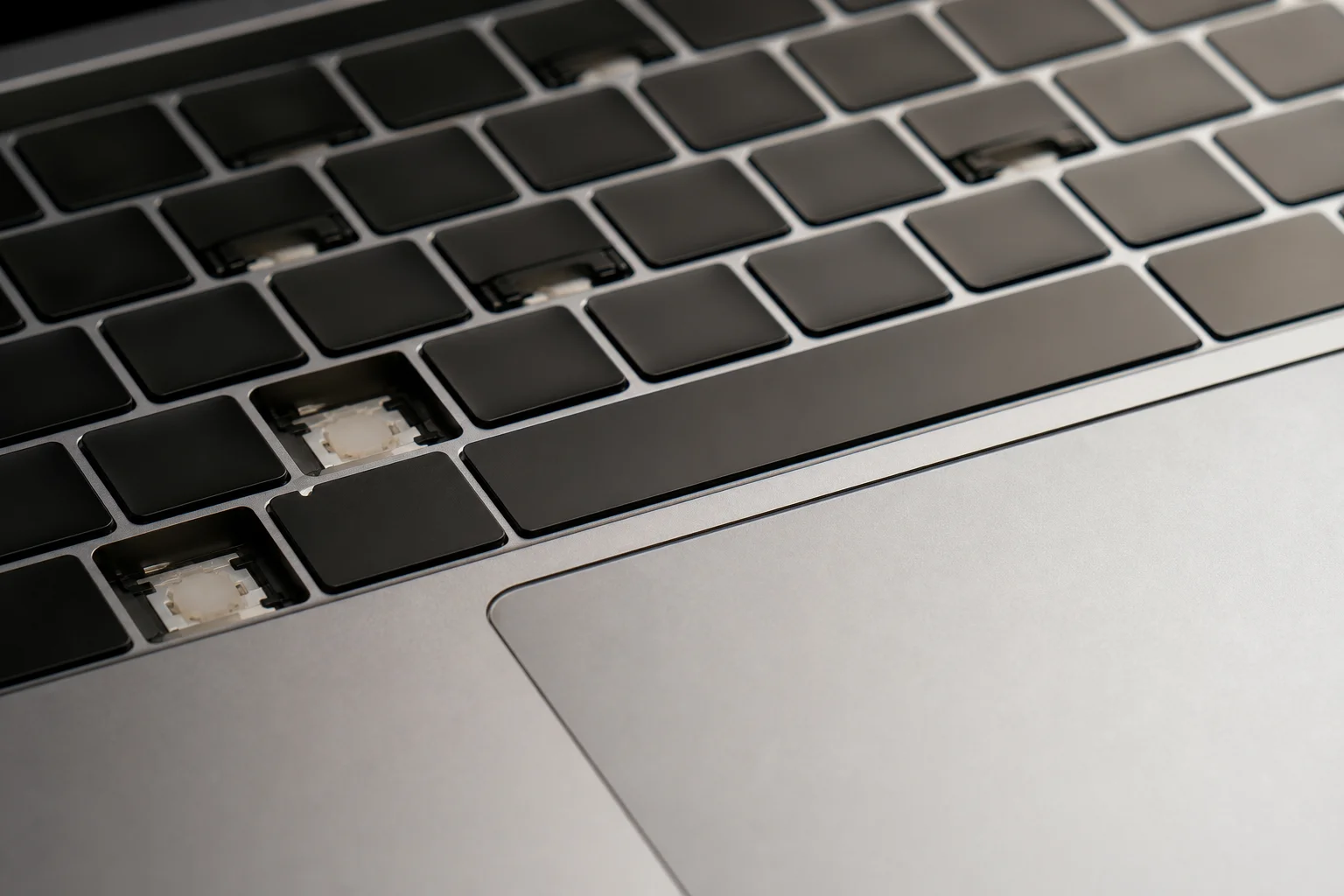 Close-up of laptop keyboard and trackpad showing build quality