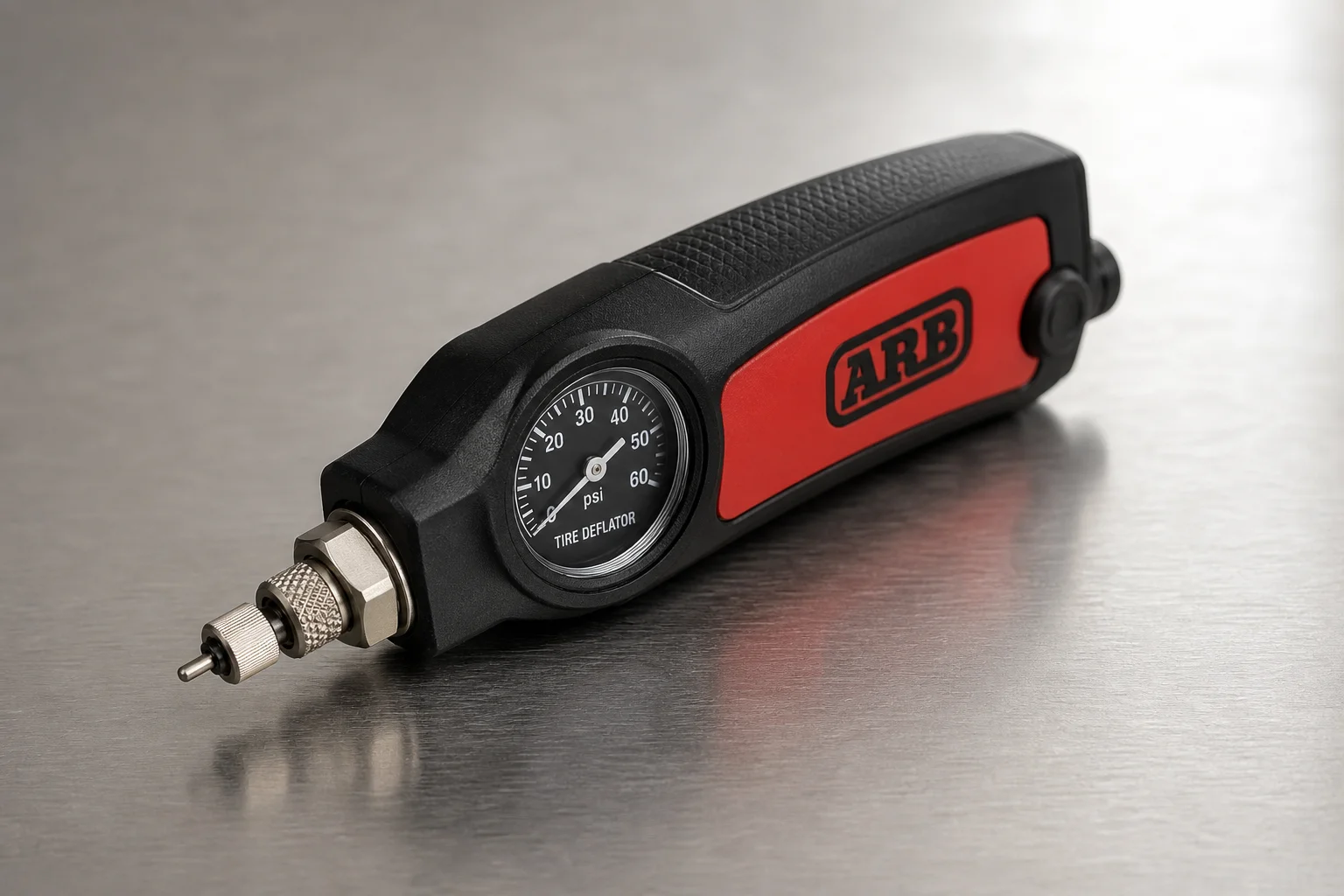放置於水泥地面的 Viair 88p 空氣壓縮機與 ARB Tire Deflator