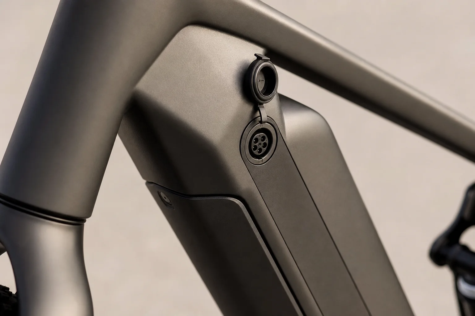 E-bike battery and charging port detail on neutral surface