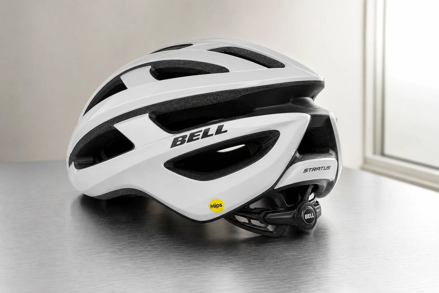 Five road bike helmets arranged in a row on concrete surface showing different designs