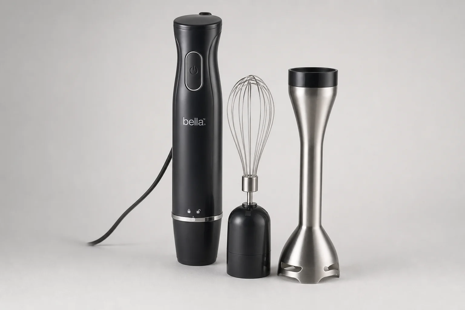 Collection of ten hand immersion blenders arranged on concrete surface