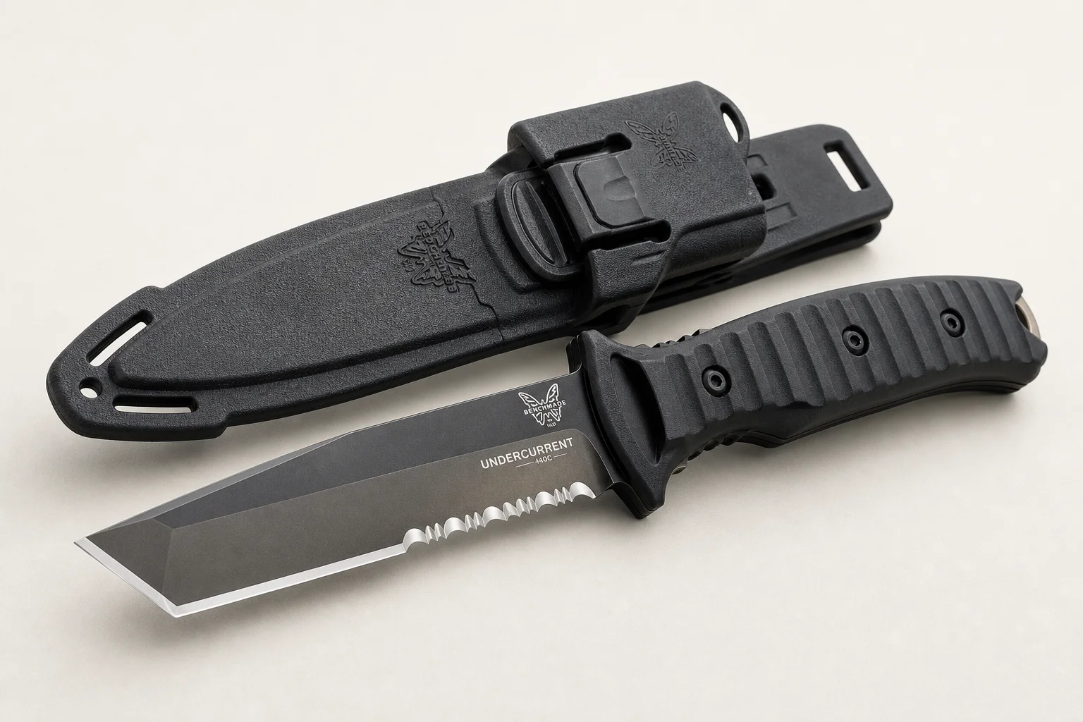 Collection of dive knives and cutting tools on concrete surface