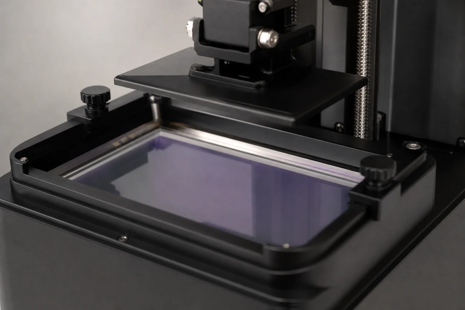 Resin vat and LCD screen of a compact resin 3D printer during operation