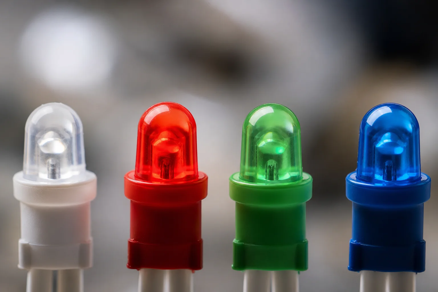 Close-up of LED light beads showing white, red, green, and blue spectrum colors