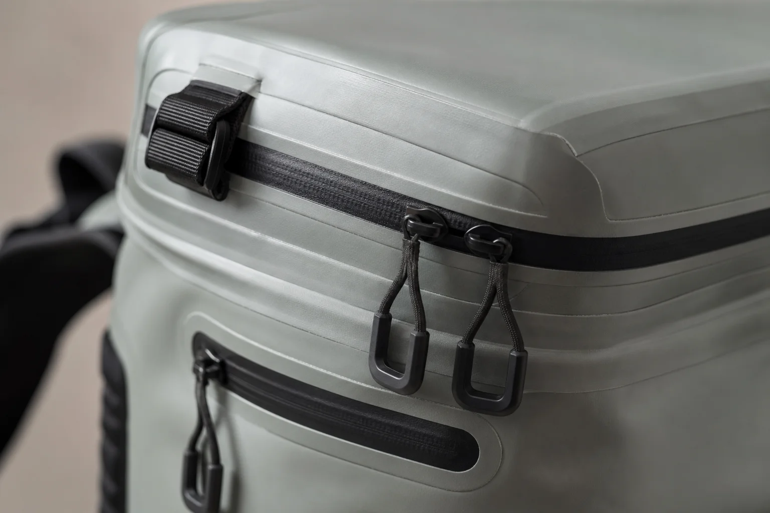 Close-up of waterproof zippers and seams on a cooler backpack
