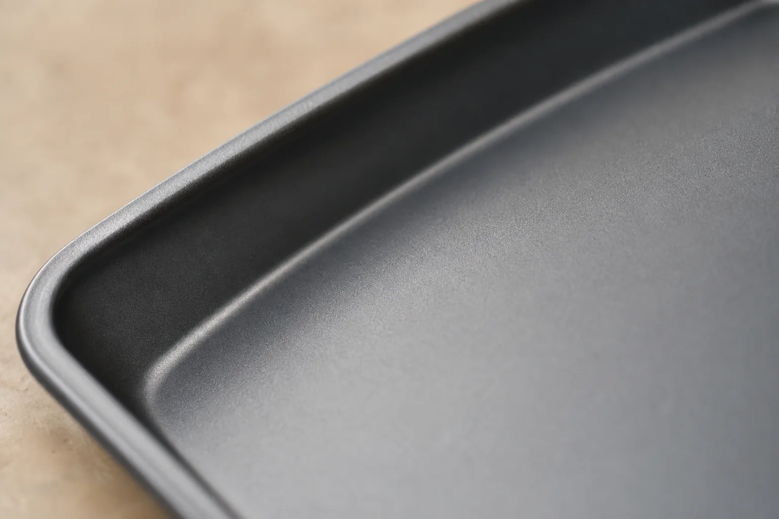 Close-up of non-stick baking pan surface showing the coating texture