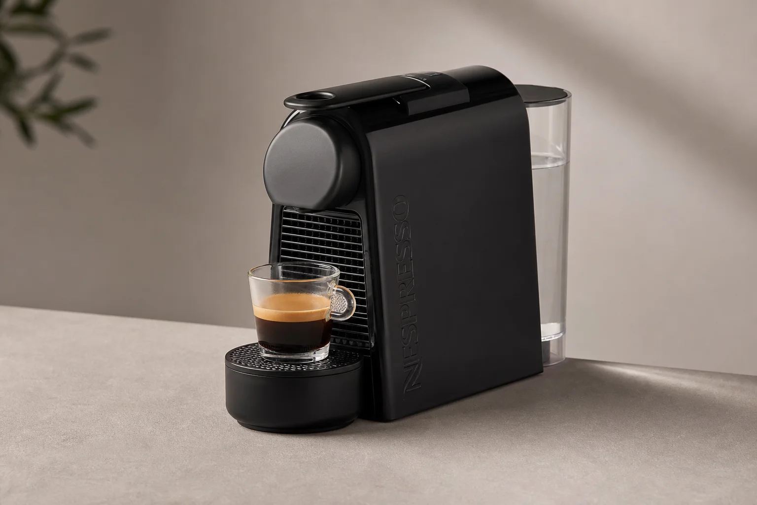 Nespresso Essenza Mini with water reservoir and espresso cup