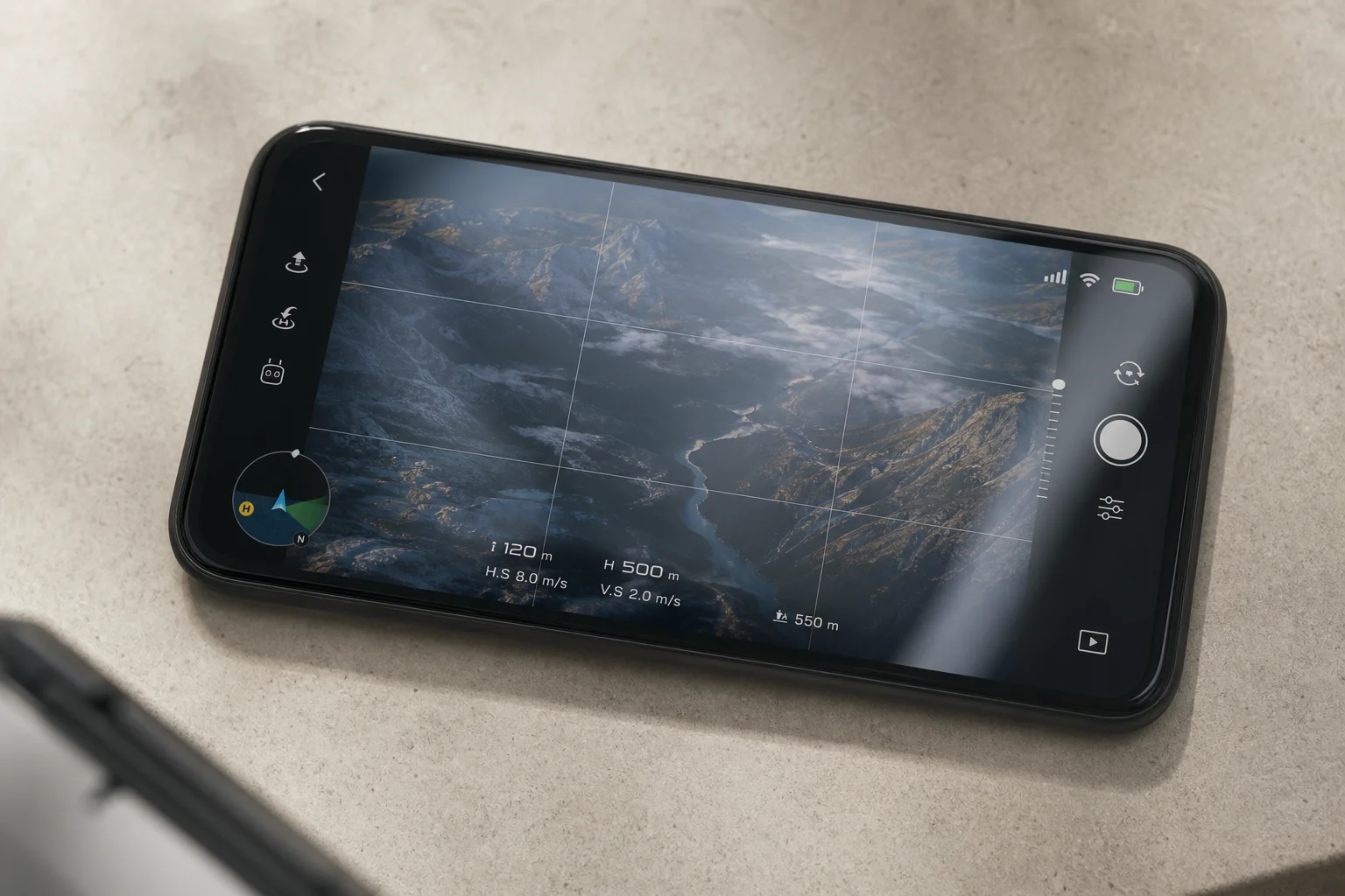 Smartphone displaying drone control interface with flight data and camera feed