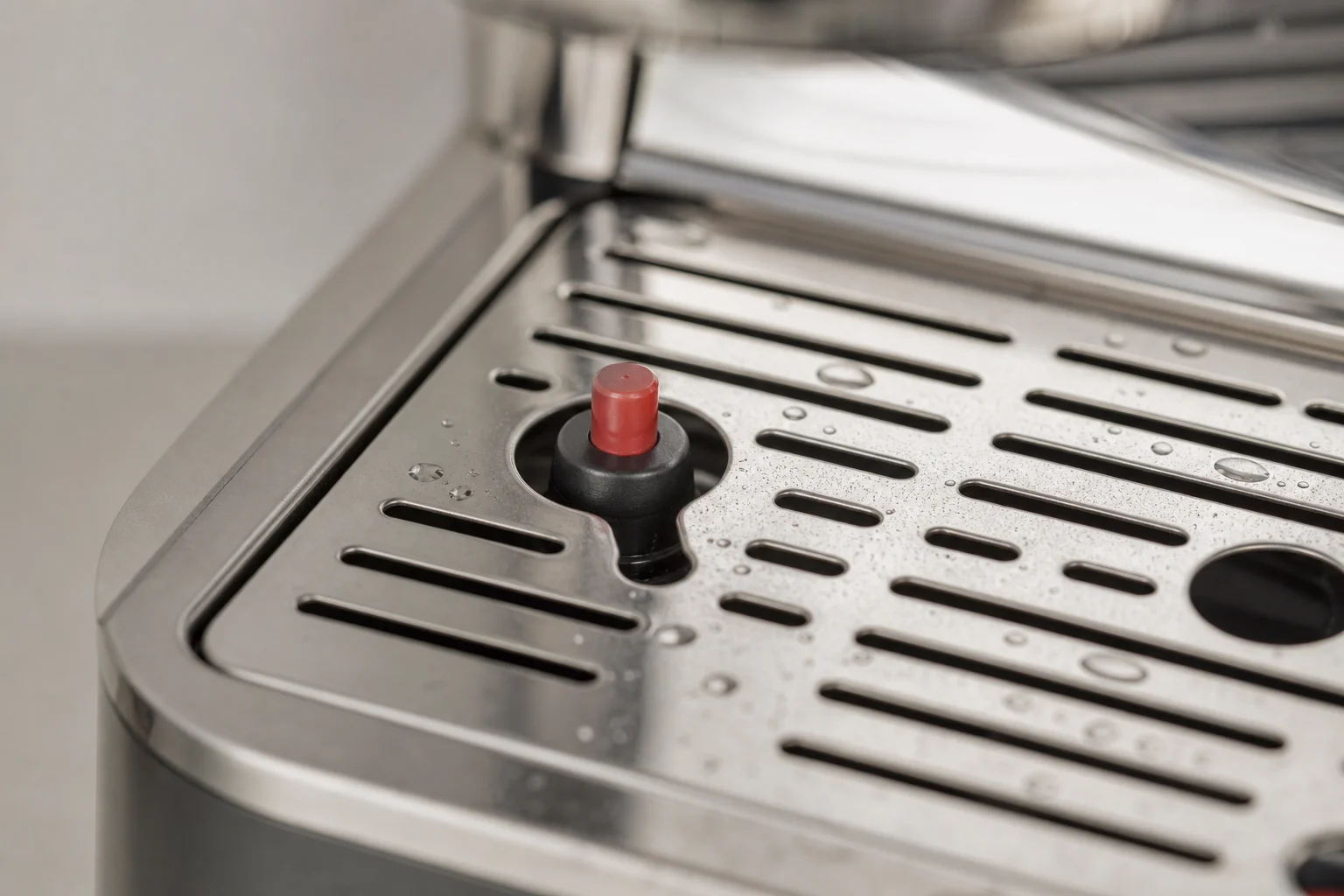Espresso machine drip tray with small float indicator visible