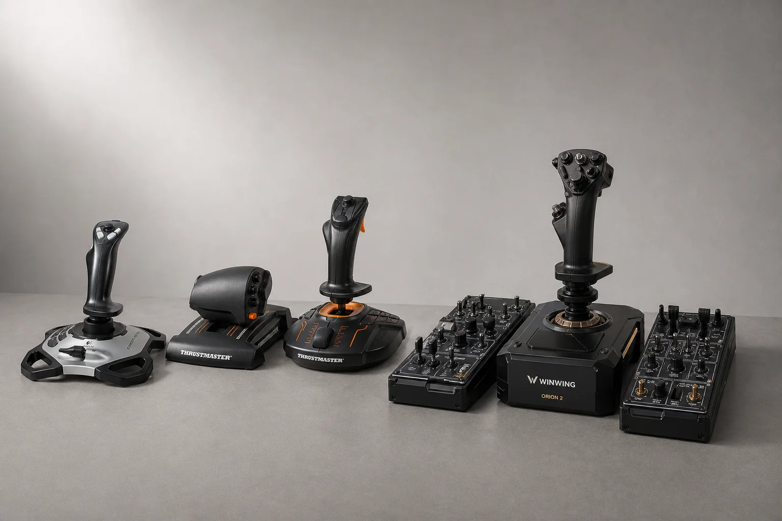 Three flight sim joysticks and throttles arranged by price tier on grey surface