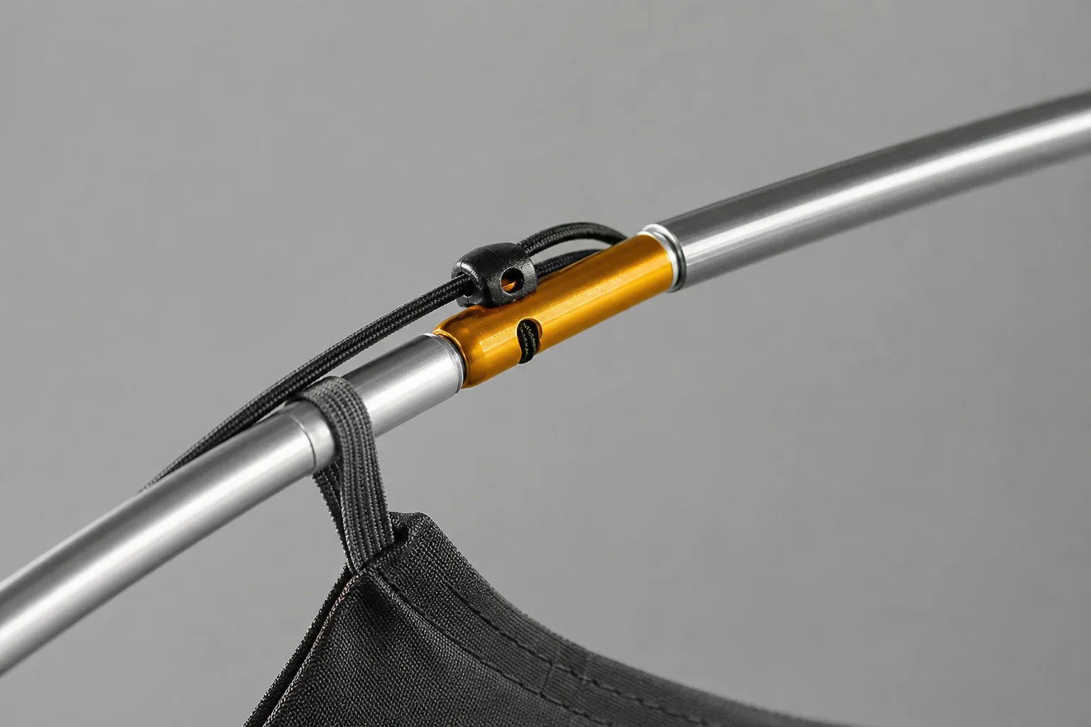 Close-up of tent pole construction showing aluminium segments and connection points