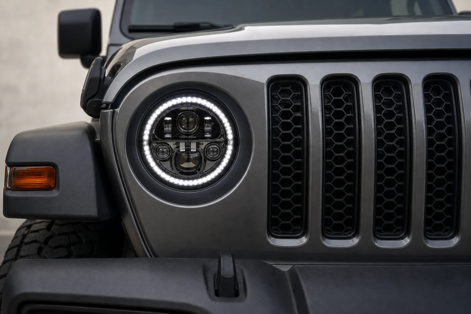 Jeep front end with installed round LED headlights in blacked-out bezel
