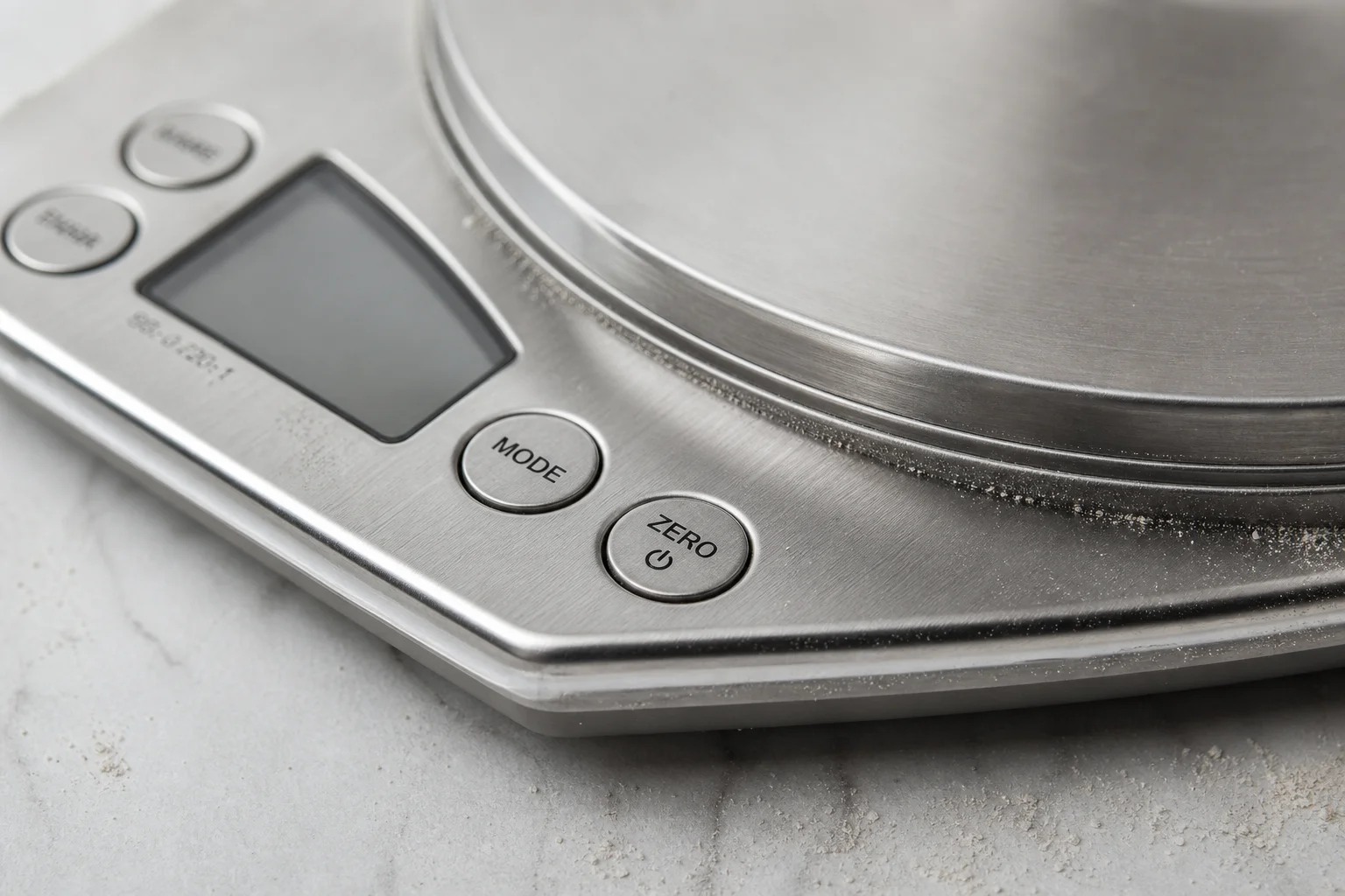 Kitchen scale platform with stainless steel surface and physical buttons