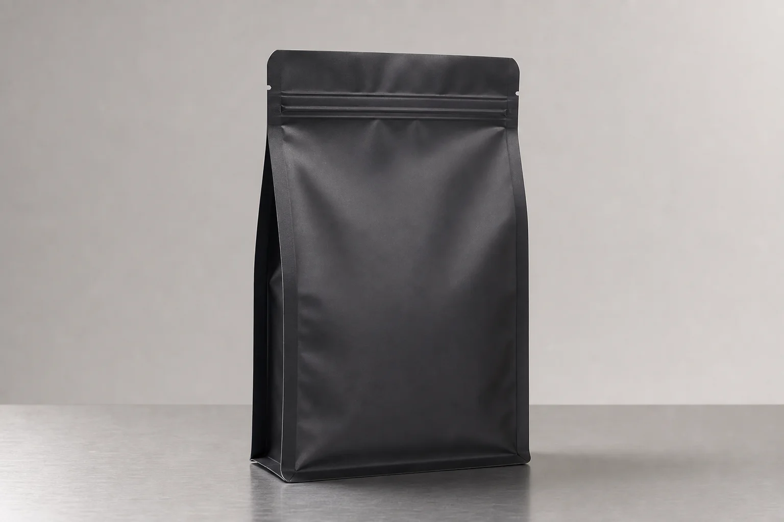 Coffee bag with resealable closure on neutral backdrop