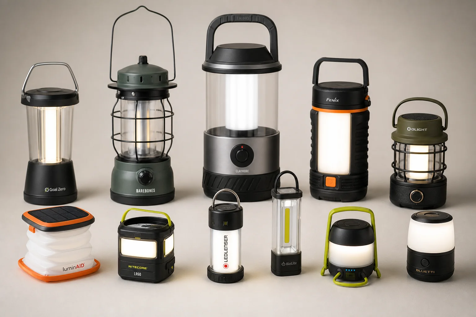 Collection of 12 rechargeable camping lanterns arranged on neutral backdrop showing various designs and sizes