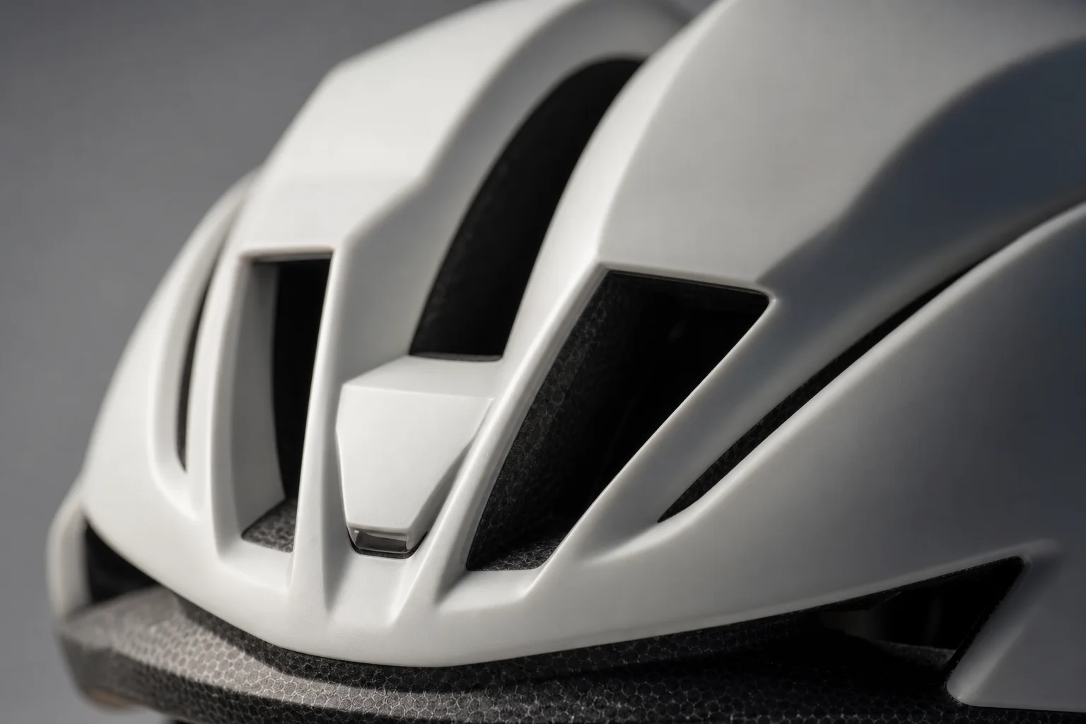Close-up of helmet ventilation vents and aerodynamic molding details