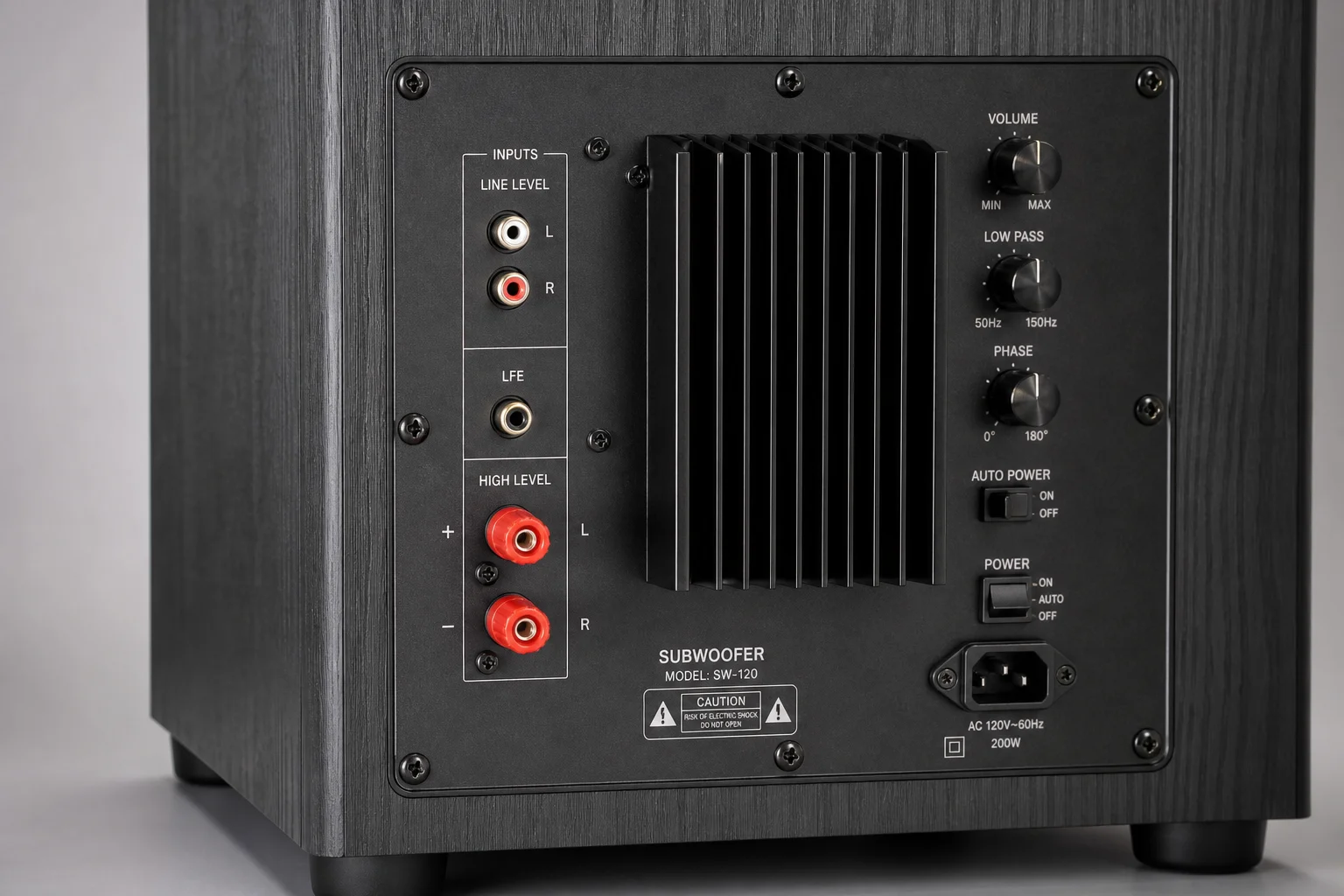 Close-up of subwoofer wiring connections and control interface