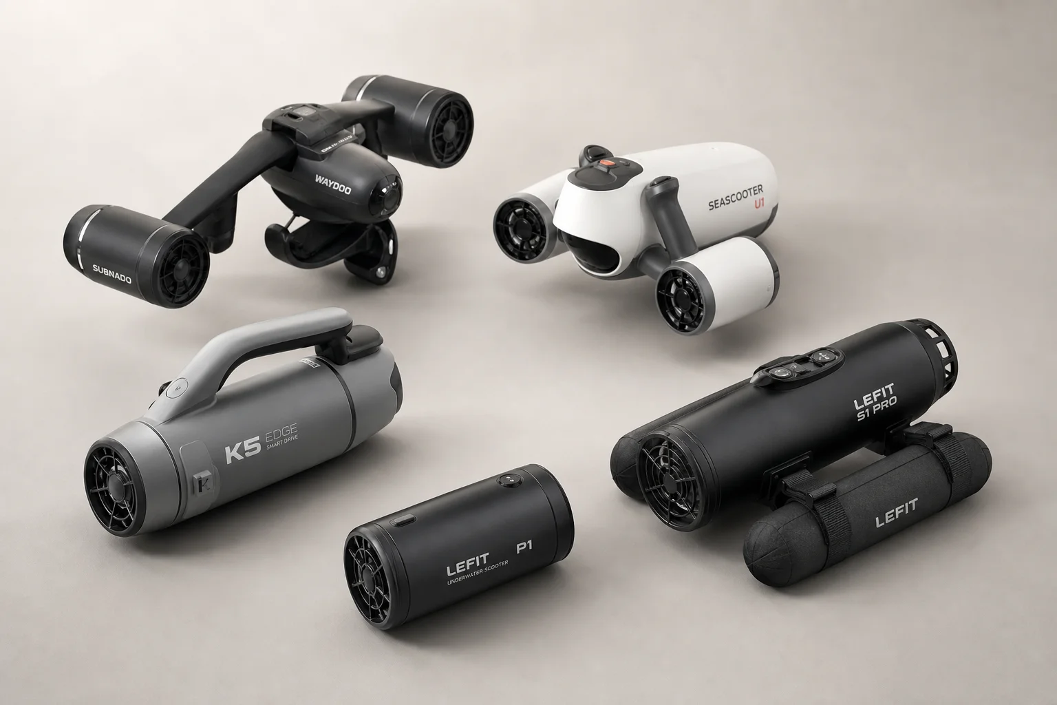 Five underwater scooters arranged on neutral backdrop showing different designs and sizes