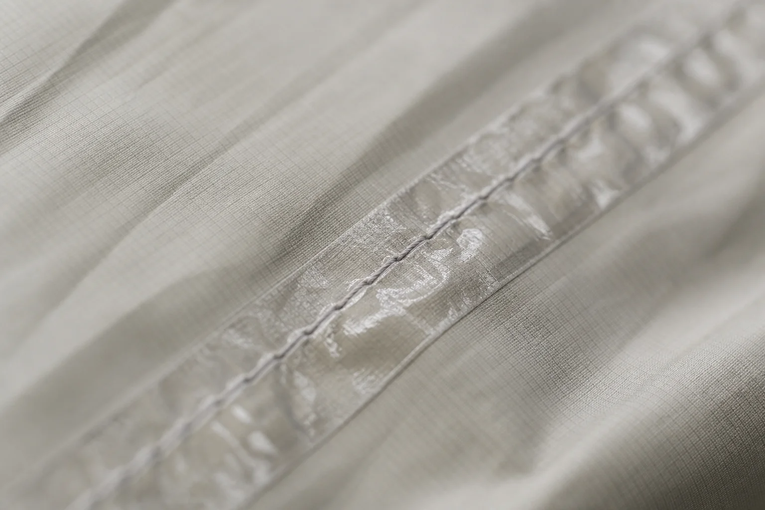 Seam taping detail on a tent fabric showing sealed stitching