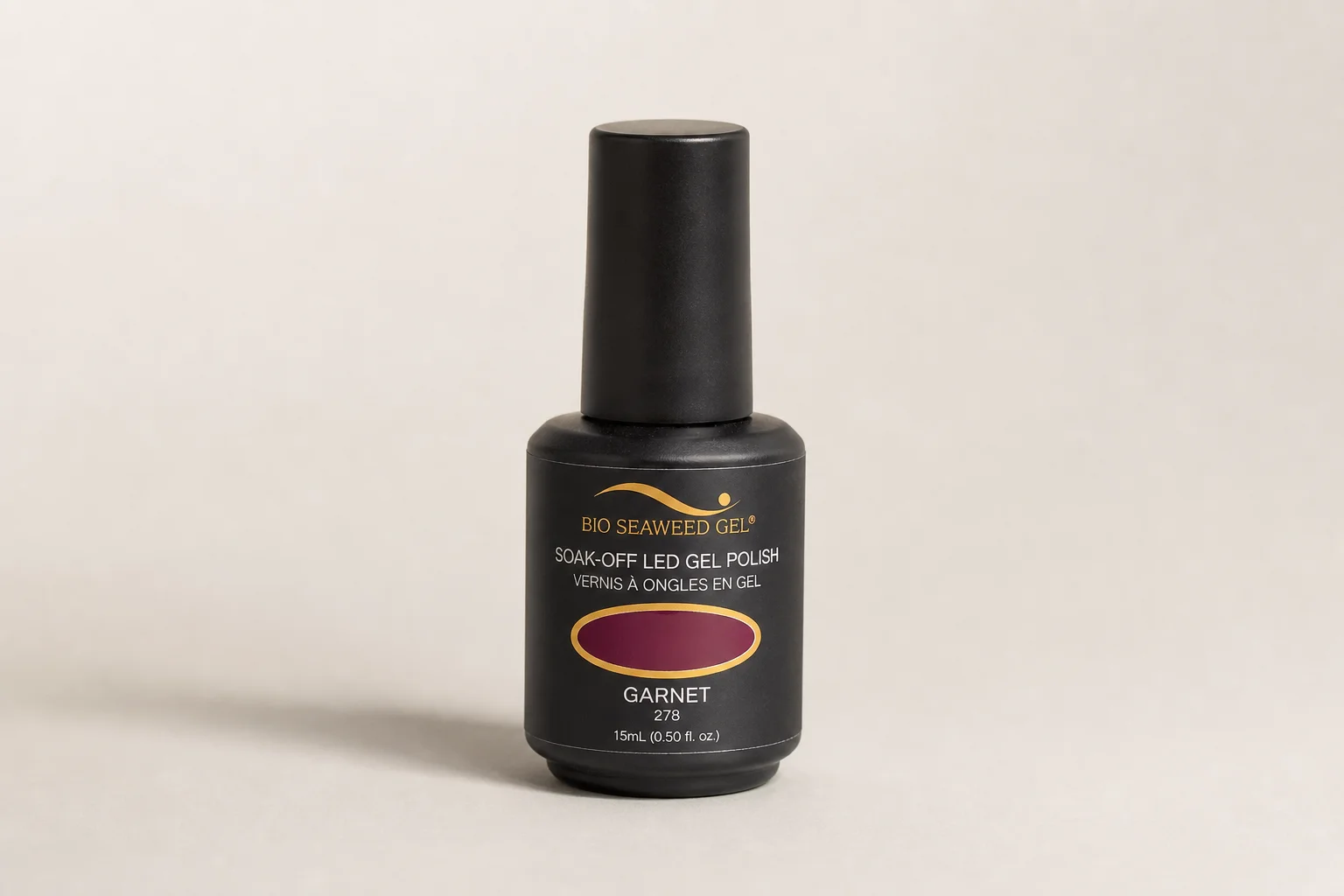 Gel polish bottles ranging from budget to premium brands arranged on marble surface