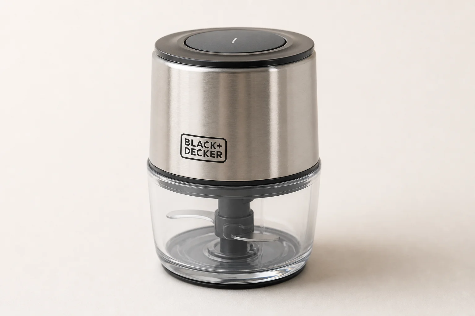 Five coffee grinders arranged by size on a concrete surface