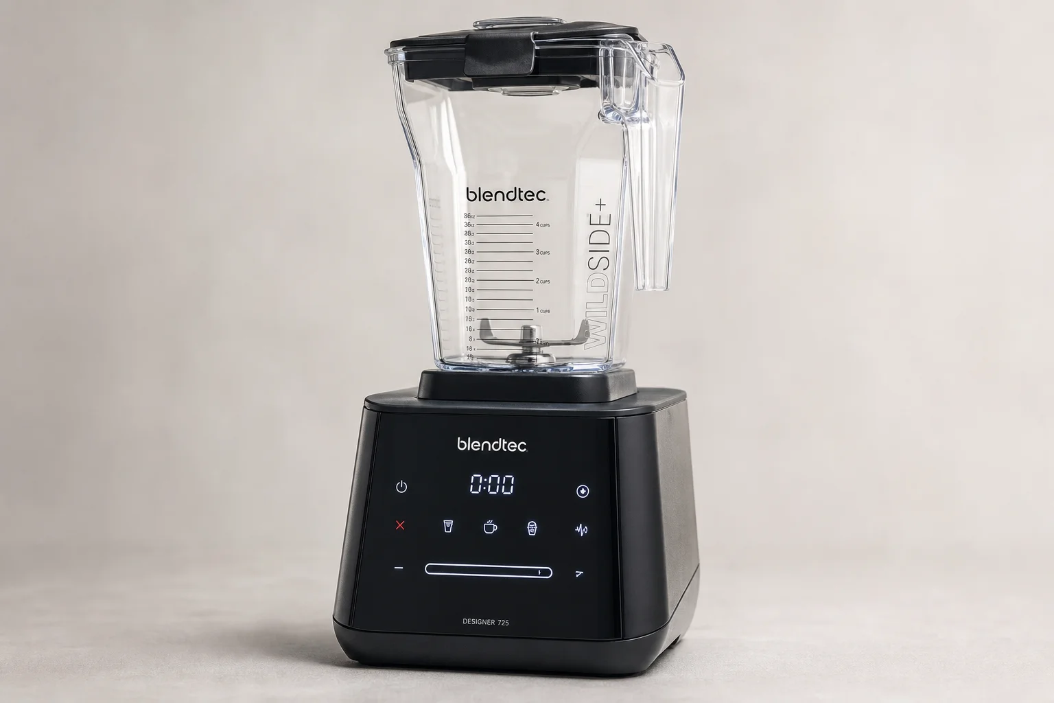 Five kitchen blenders arranged on concrete surface from compact to premium models