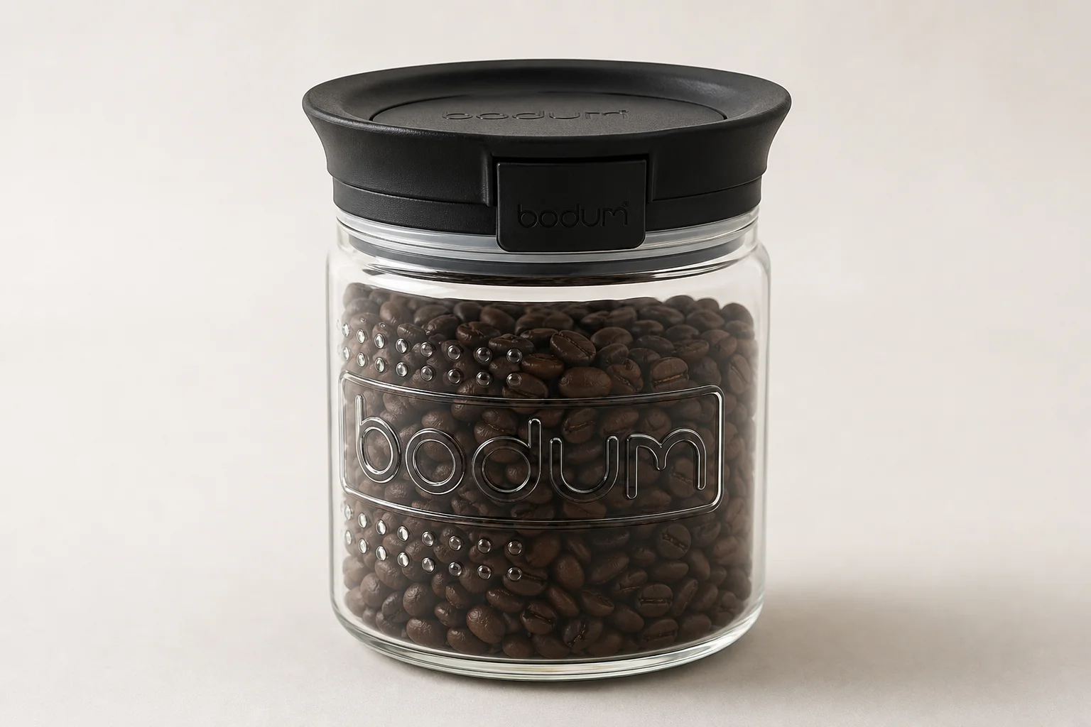 Eleven coffee storage containers arranged by category on concrete surface