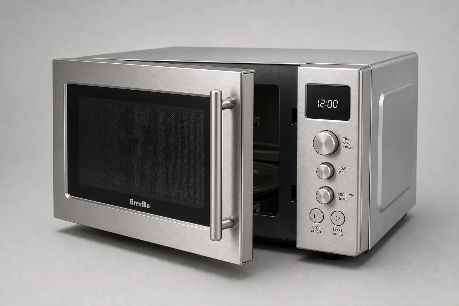 Microonde da appoggio Breville e Sharp affiancati su un piano cucina