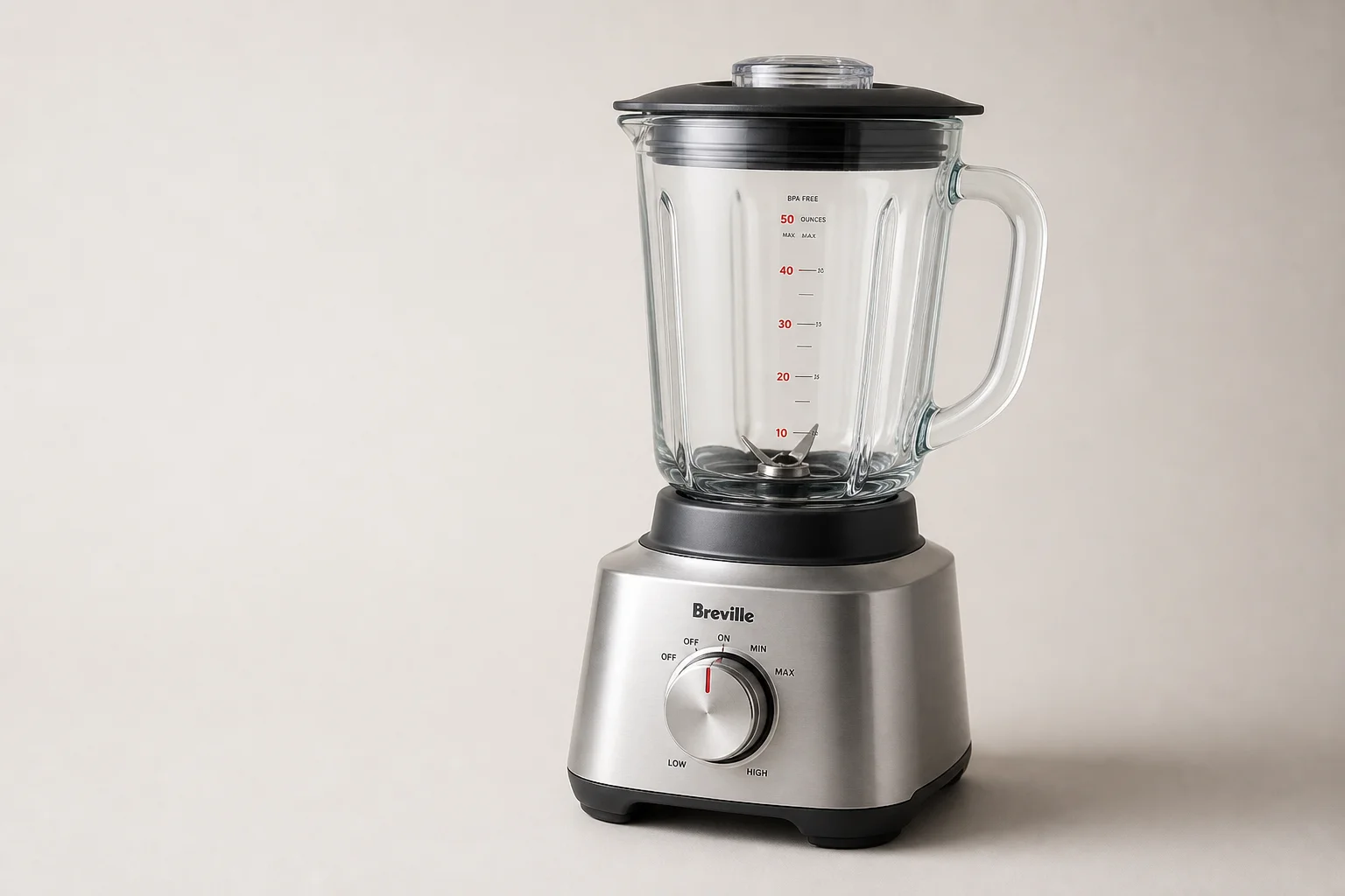 Five kitchen blenders arranged on concrete surface from compact to premium models