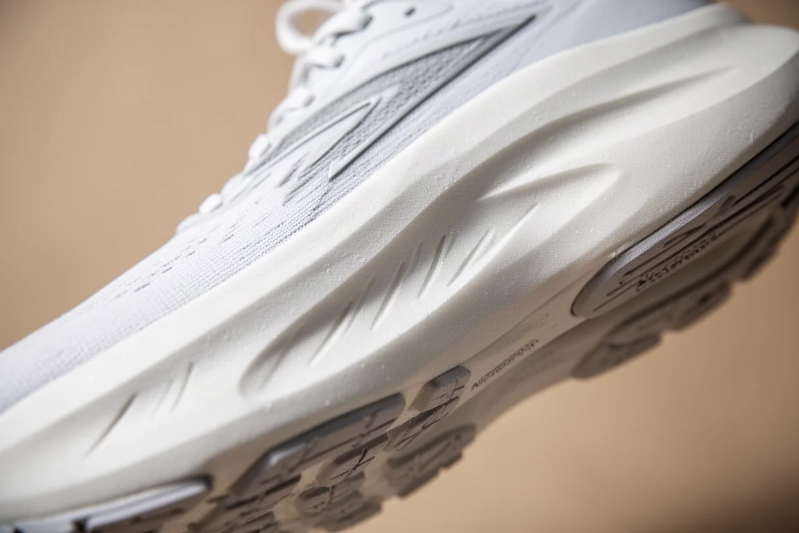 Cross-section view of thick foam midsole under a running shoe