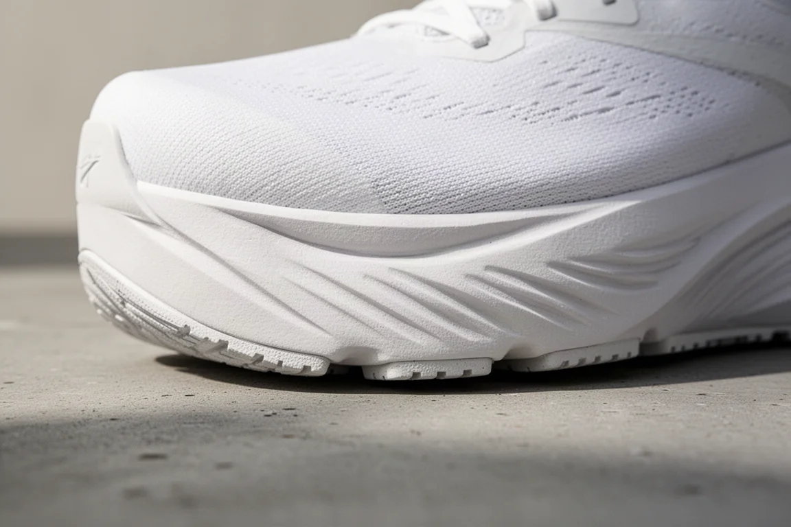 Close-up of a thin breathable running shoe upper with mesh texture