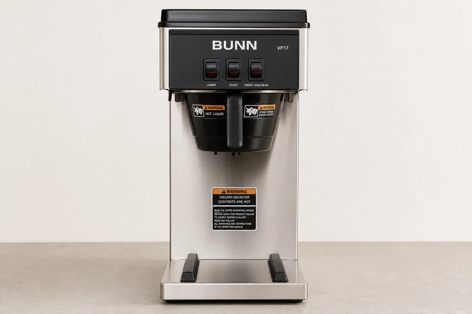 Six non-toxic coffee makers arranged on concrete: percolator, Chemex, La Pavoni, Flair Pro 3, Bunn VP17, and Ratio 8