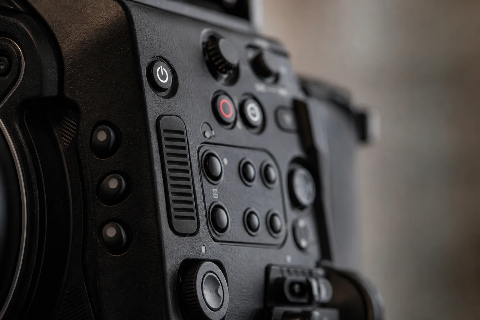 Close-up of camera control buttons and customizable function buttons on cinema camera body