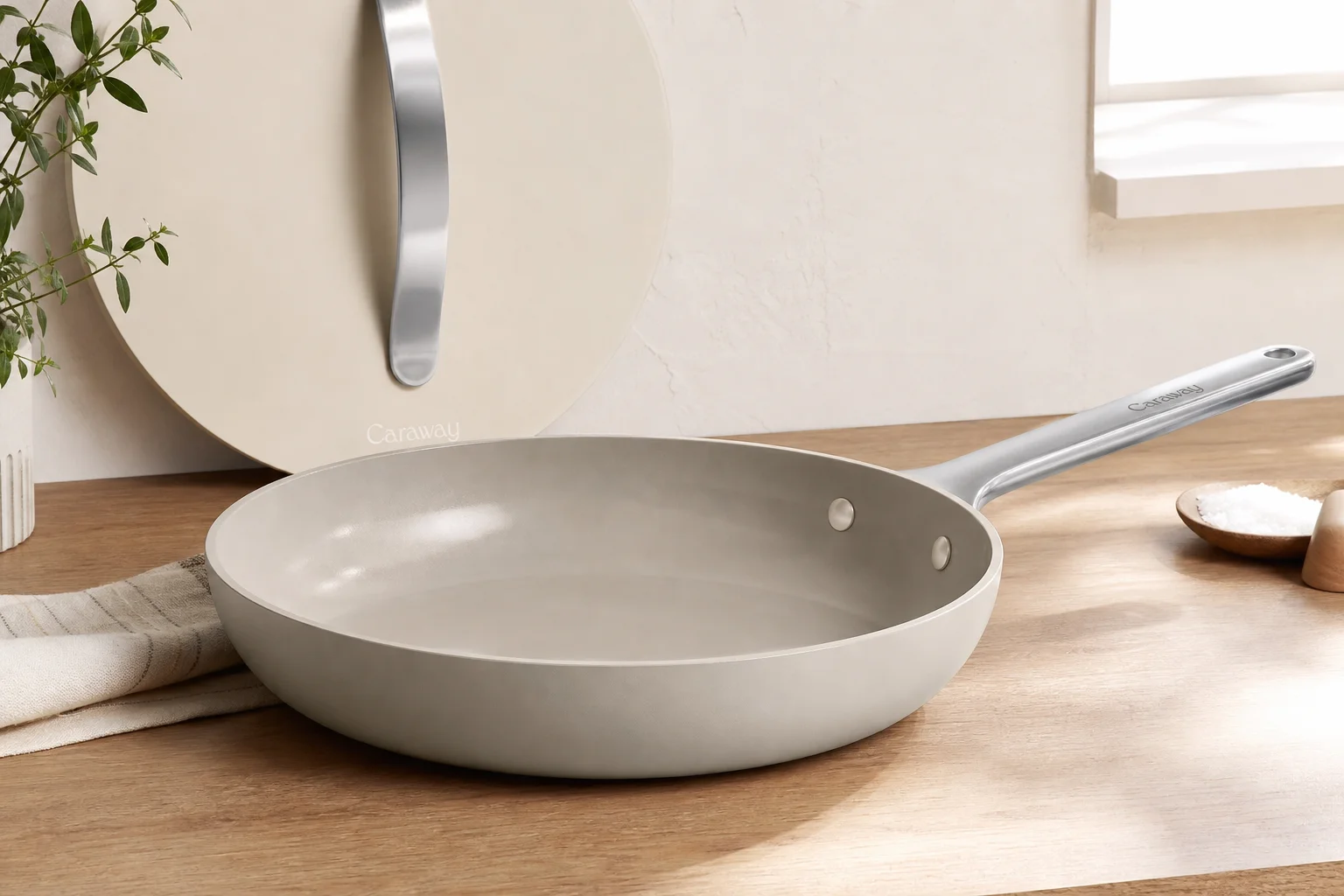 Five cookware brands displayed together on neutral backdrop