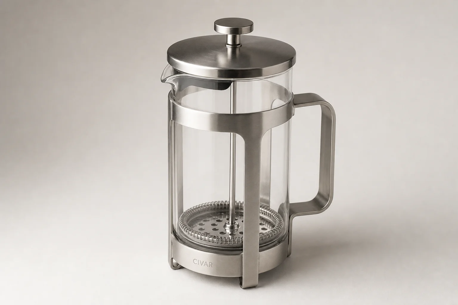 Five non-toxic French press coffee makers displayed on concrete surface