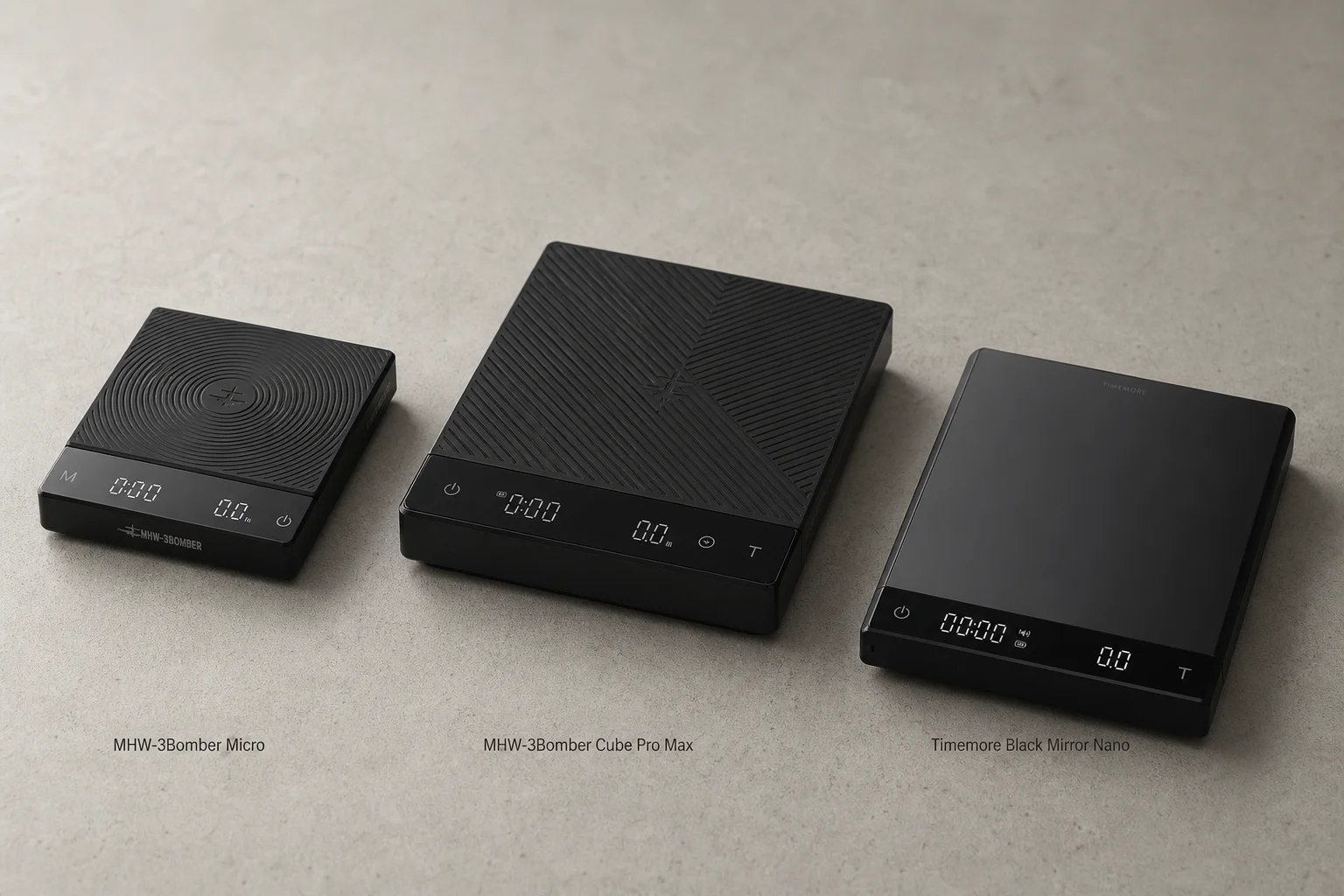 Three compact coffee scales arranged on concrete: MHW-3Bomber Micro, Cube Pro Max, and Timemore Black Mirror Nano