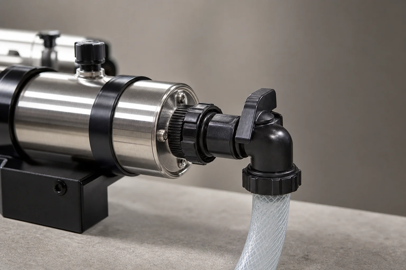 Close-up of UV sterilizer hose connection and directional outlet fitting