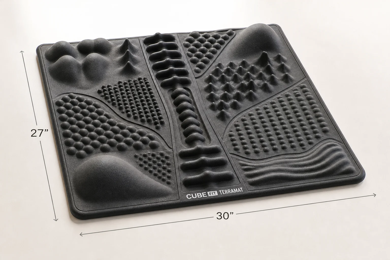 Five standing desk mats displayed on grey concrete surface