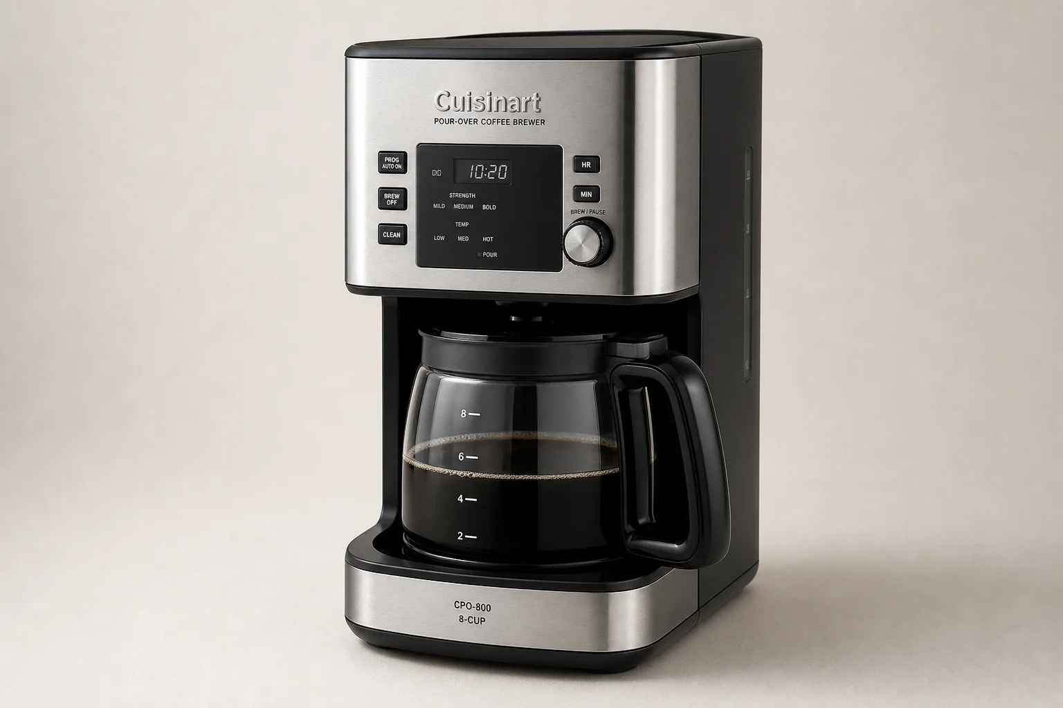 Five pour over coffee makers arranged on concrete surface showing variety of styles and designs